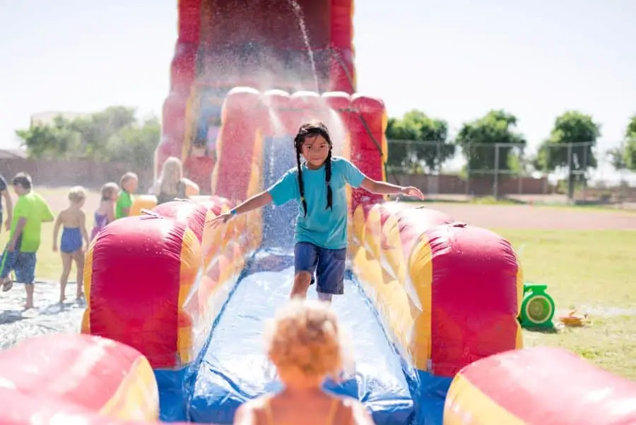 girl enjoying a water slide